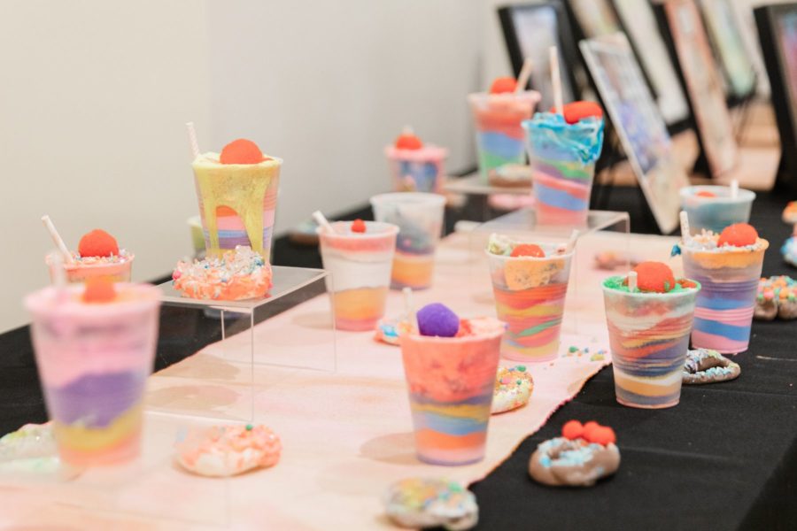 MILKSHAKES + DONUTS | Sand, Liquid Elmer’s Glue, Collage Materials, Aquarium Gravel in Plastic Cups | These sweet treats were created just for fun! Children were enjoying dumping and pouring sand, and we were making a lot of pretend smoothies in our sensory area, so the sand milkshake was born!
