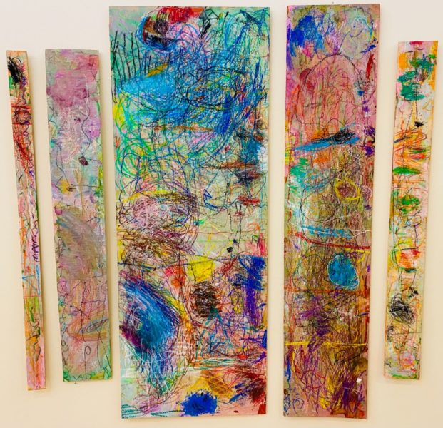 SCRIBBLE SPECTACULAR | Acrylic Paint, Tempera Paint, Oil Pastel on Plywood | Children need movement and stimulation! All students were invited to participate in mark making on these pieces of wood. There were no instructions given, just materials available for children to use while they got to know each other and familiarize themselves with the variety of materials that are in the art studio. Children scribbled away to create this large scale masterpiece.