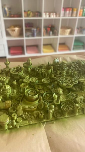 STICKY TOWN | Recyclable Materials, Mixed Media Assemblage | Students enjoyed digging through recycled treasures and arranging them, playing with them, and adhering them to each other and this board. They enhanced their ability to think critically while arranging, stacking, and experimenting with size, balance, and weight, while promoting creativity. Loose parts require a great deal of imagination to become other things – like towns!